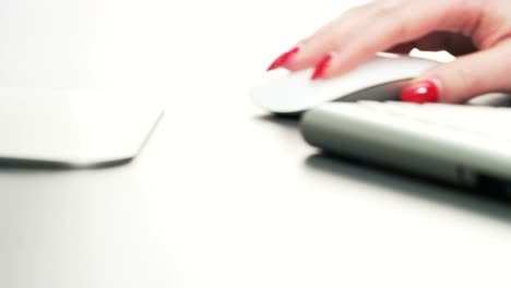 Woman-Using-Mouse-and-Typing-on-a-Keyboard