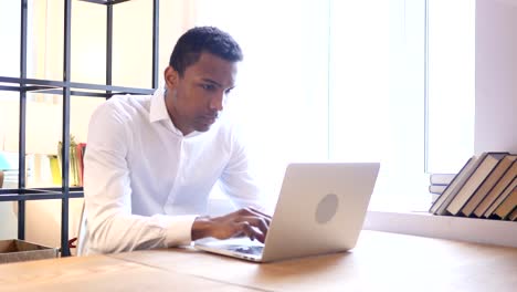 Anxious-Worried-Black-Man-Working-On-Laptop