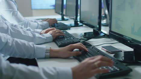 Group-People-working-in-bright-Office.-Shot-of-Typing-Hands-while-working-on-the-Computer.