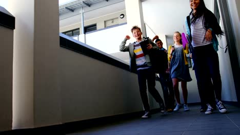 Group-of-classmate-running-in-corridor