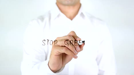 Stop-Greed,-Man-Writing-on-Glass