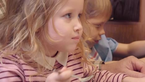 Little-Girl-Enjoying-Sweet-Cake