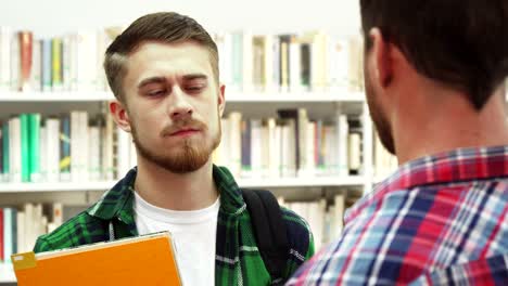 Two-serious-young-men-talk-about-something