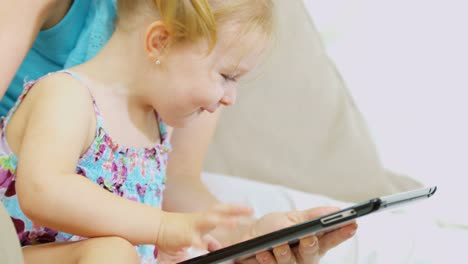 Portrait-of-girl-playing-touch-screen-game-indoor