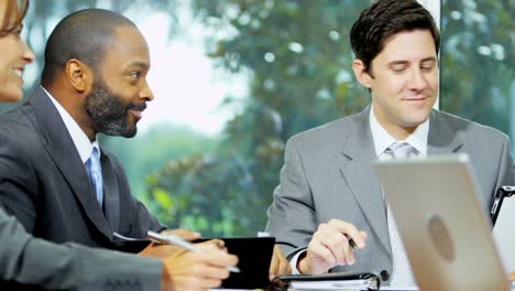 Multi-ethnic-managers-discussing-business-strategy-in-boardroom