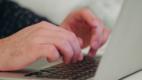 Man's-Hands-Typing-on-a-Laptop