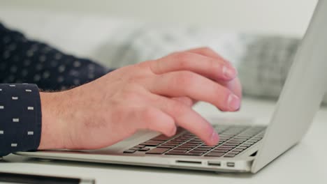 Man's-Hands-Typing-on-a-Laptop