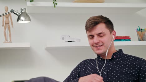 A-Young-Man-Listening-to-Music-Indoors