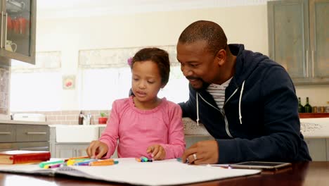 Father-and-daughter-playing-with-colour-crayons-4k