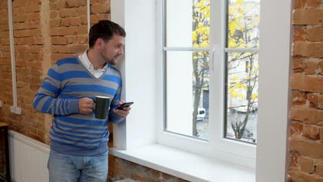 Young-man-using-vr-glasses-for-watching-the-video-in-the-modern-office.