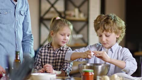 Young-Boy-Learning-to-Crack-Eggs