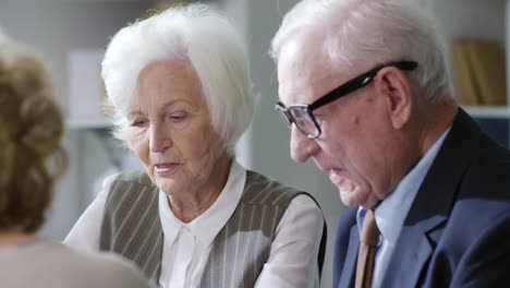 Senior-Woman-and-Man-Talking-on-Business-Meeting