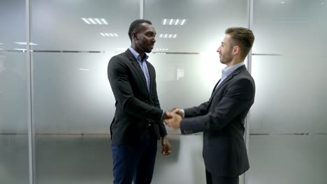 Two-business-partner-shake-hands-when-meeting