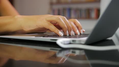 Close-up-of-female-hands-typing-on-laptop