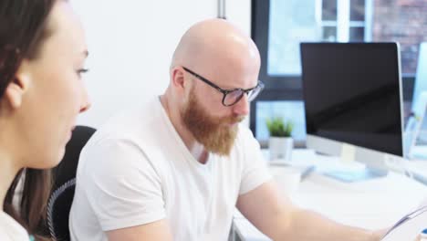 Office-workers-examining-files