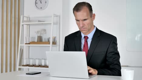 Businessman-Working-On-Laptop