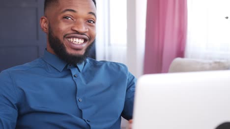 Businessman-video-conferencing-on-laptop