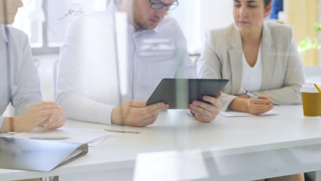 business-team-with-papers-working-at-office