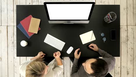 Two-managers-working-discussing-project-on-the-screen-of-computer.-White-Display