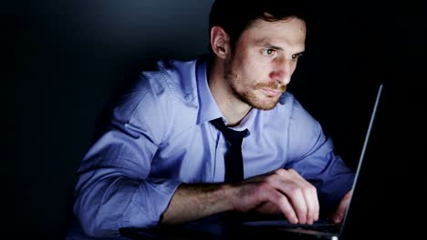 Young-Businessman-Focused-on-Work-During-Overtime