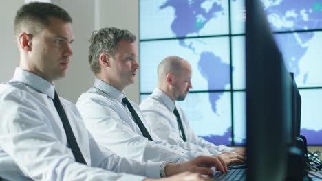 Team-of-IT-Professionals-Working-at-the-Computers-in-Bright-Office.