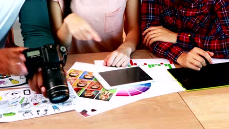 Group-of-graphic-designers-working-together-at-desk