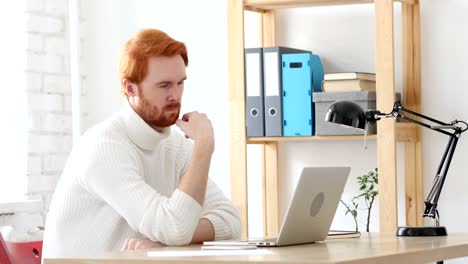 Man-with-Red-Hairs--Thinking-and-working-in-His-Office