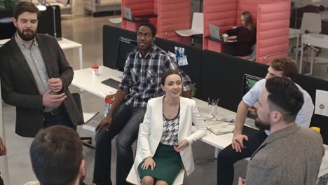 Businesspeople-Laughing-and-Chatting-on-Lunch-Break