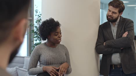 African-Businesswoman-Telling-Funny-Story-to-Coworkers