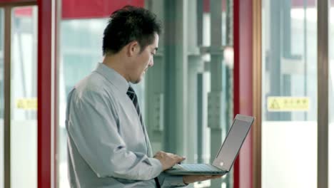 asian-corporate-businessman-using-laptop-computer