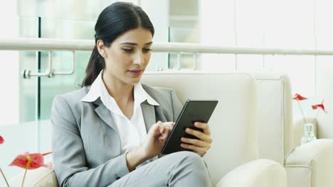 Spanish-business-female-using-wireless-mini-tablet-technology