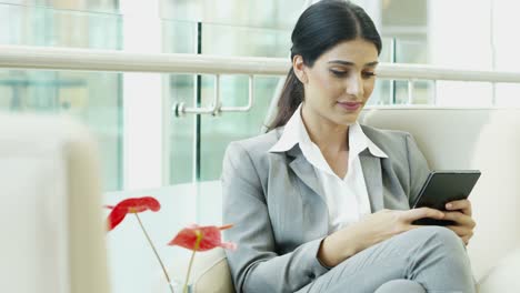 Ambitious-brunette-Hispanic-corporate-businesswoman-with-wireless-device