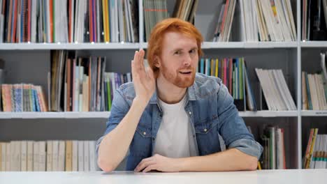Redhead-Man-Listening-Secret-Carefully-in-Office,-Library