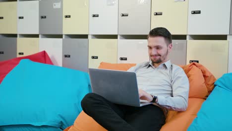 A-Young-Businessman-Using-a-Laptop-Indoors