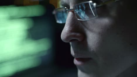 Programmer-in-Eyeglasses-Working-on-Computer-at-Night