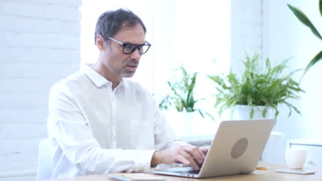 Thumbs-Down-by-Middle-Aged-Man-at-Work,-Both-Hands