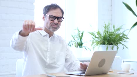 Thumbs-Down-by-Middle-Aged-Man-at-Work,-Both-Hands