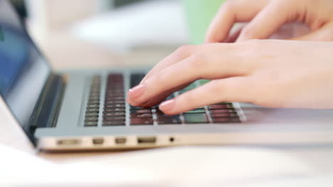 Woman-hands-working-on-laptop-computer.-Worker-typing-on-a-keyboard