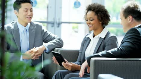 Multi-ethnic-business-team-ending-meeting-with-handshake