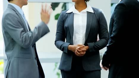 Multi-ethnic-male-female-finance-executive-business-meeting