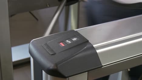 Hands-of-people-apply-electronic-pass-to-turnstile-wicket-checkpoint-in-office.