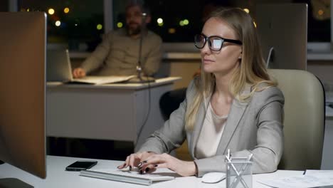 Woman-Writing-Emails-on-Desktop-Computer