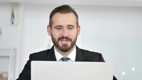 Businessman-Talking-During-Online-Video-Chat-at-Work