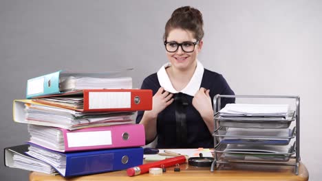 Woman-sitting-at-desk-in-office-working,-humour-4K