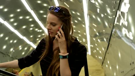 Woman-Having-an-Important-Phone-Call-on-the-Escalator