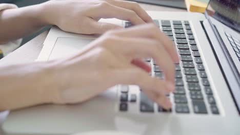 Beautiful-young-smiling-asian-woman-working-laptop-on-desk-in-living-room-at-home.-Asia-business-woman-writing-notebook-document-finance-and-calculator-in-home-office.-Enjoying-time-at-home-concept.