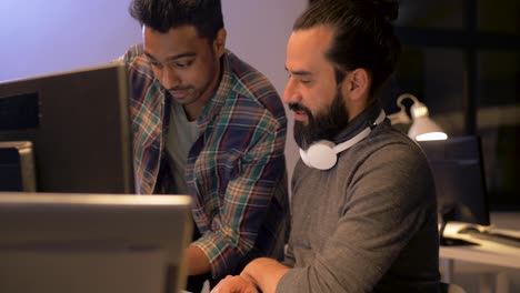 creative-team-with-computer-working-together-late-at-night-office