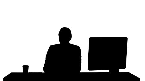 Silhouette-Excited-business-woman-talking-on-camera-sitting-at-desk