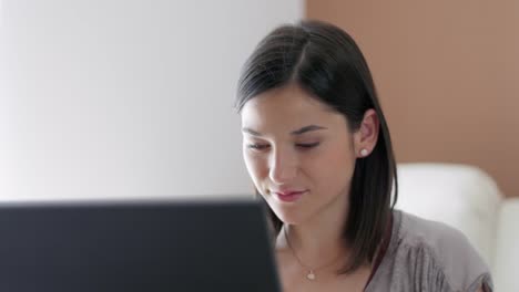 Nice-girl-at-home-by-her-laptop