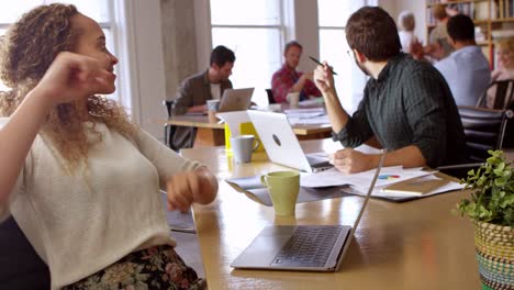 Businesswoman-Dancing-At-Desk-In-Office-Shot-On-R3D